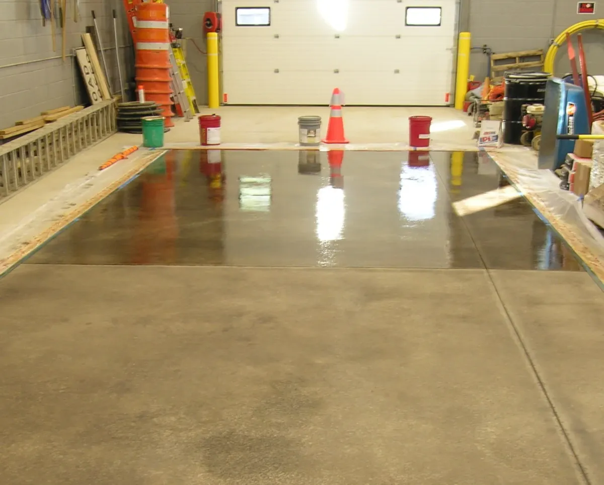 Floor Shield of Kansas City Clear-coated concrete floor showing raw concrete underneath
