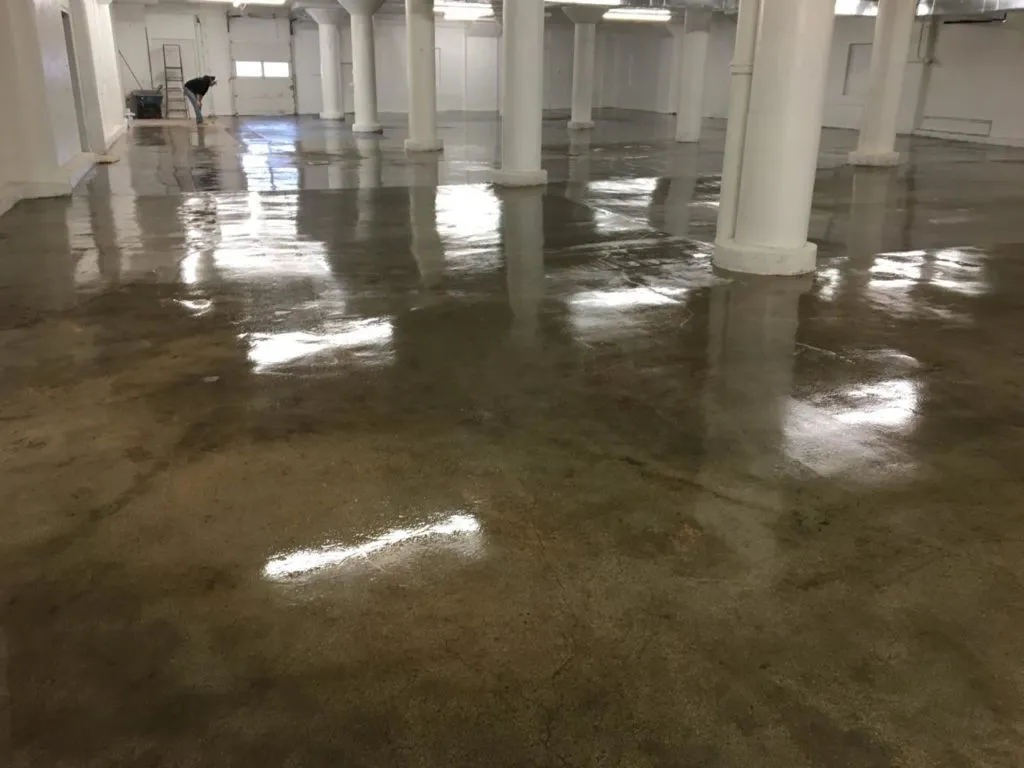 Floor Shield of Kansas City Polyaspartic clear coat on natural concrete